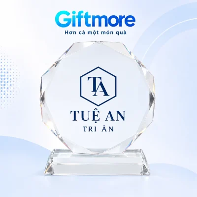 Demo monogram TA trong lục giác và chữ TUỆ AN TRI ÂN màu navy trên mặt biểu trưng bát giác