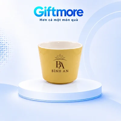 Cốc Khánh An 220ml men vàng không quai in logo – xem nhận diện bình an trên thân cốc